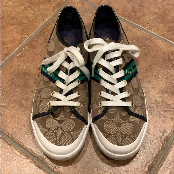 white tennis shoes with green back